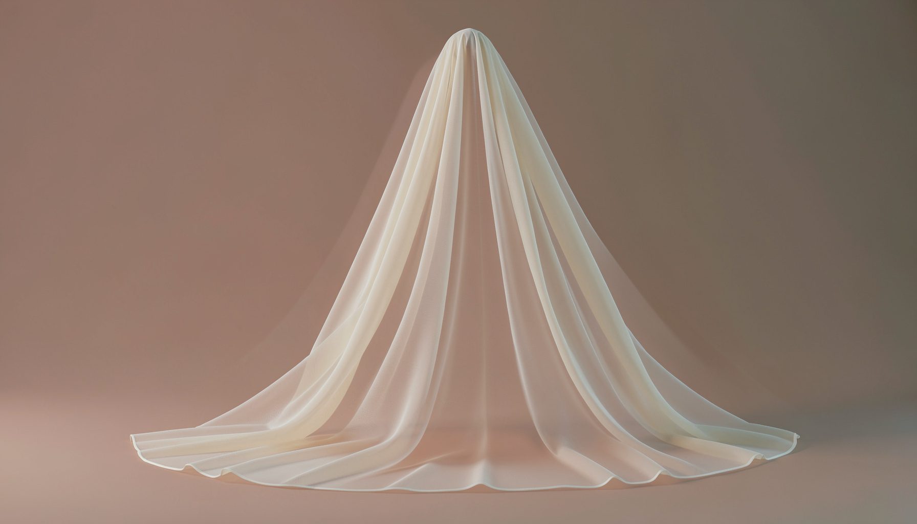 Soft sheer ivory tulle wrap veil cascading in cathedral length, draped romantically against a warm blush backdrop with gentle folds catching the light